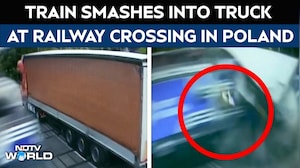 Dramatic CCTV Shows Train Collision At Railway Crossing In Poland