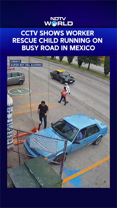 CCTV Captures Heart-Stopping Rescue As Child Runs Into Busy Road