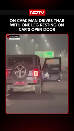 On Cam: Man Drives Car With One Leg Resting On Open Door Of Moving SUV In Gurugram
