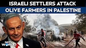 Israeli Settlers Attack West Bank Olive Harvesters, Set Vehicles On Fire