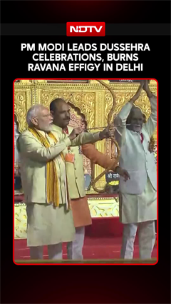 PM Modi Fires Arrow At Ravana Effigy During Grand Dussehra Celebrations