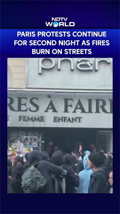 Paris Protests Continue For Second Night As Fires Burn On Streets