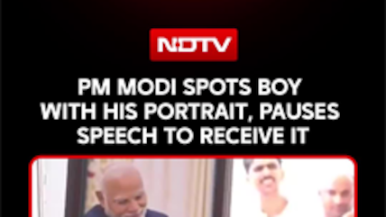 PM Modi Stops His Speech To Receive Portrait From Young Fan In The Crowd