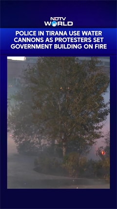 Police In Tirana Use Water Cannons As Protesters Set Government Building On Fire