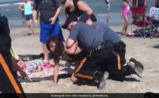 Cop Seen Punching Woman In The Head; Onlookers Told Her "Stop Resisting"