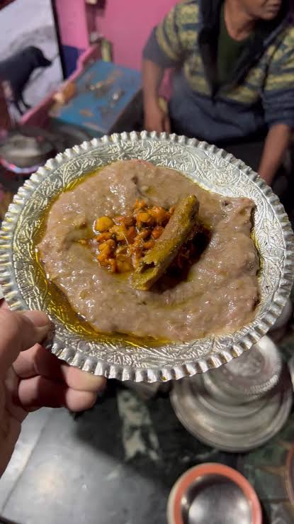 Traditional Kashmiri Harissa served hot in copper plate during winter