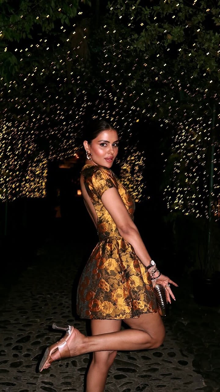 Priyanka Chaudharys warm-toned makeup features well-defined eyes and glossy pink lips, exuding glamour.