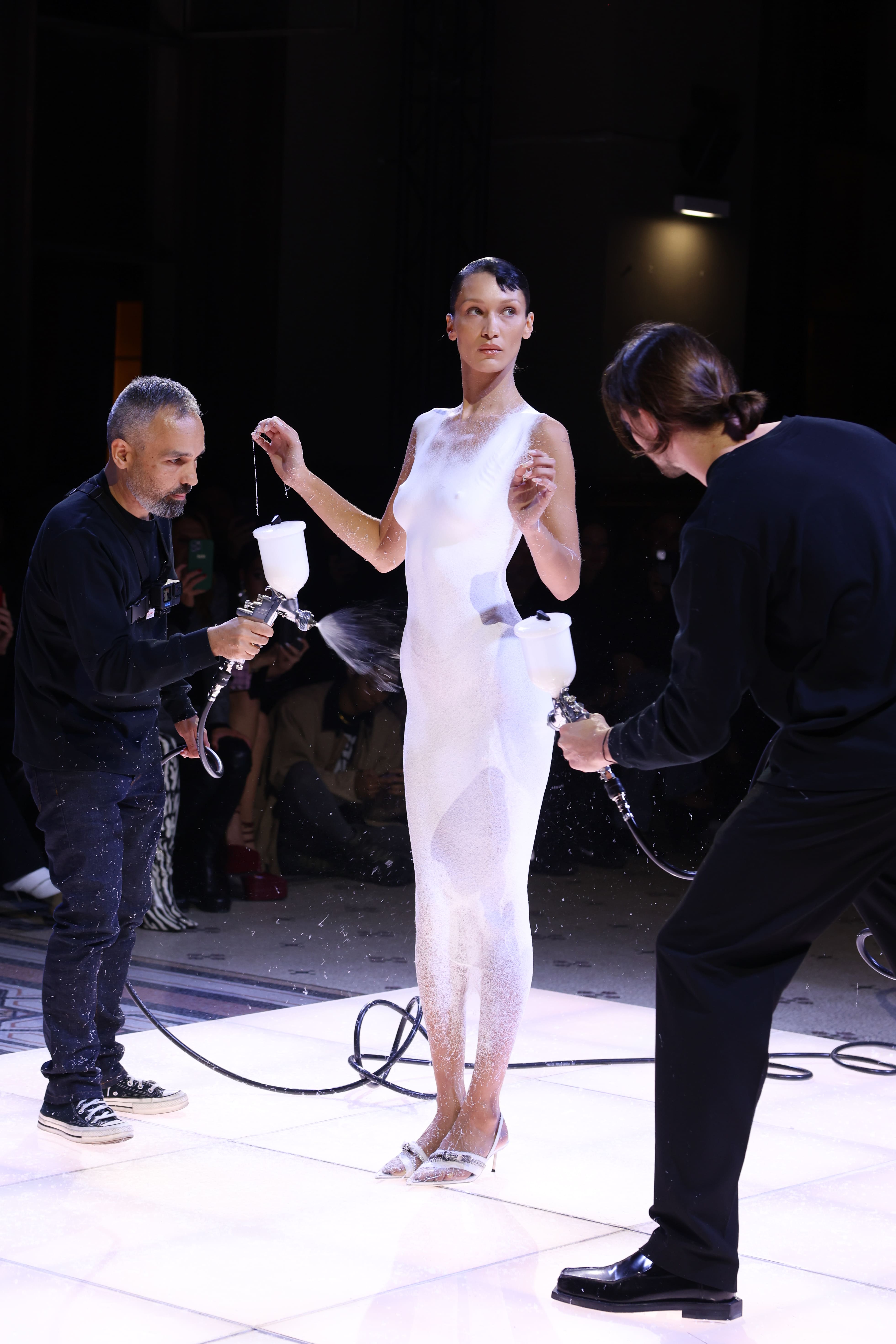 spray on dress runway Model has dress sprayed onto body on Coperni runway