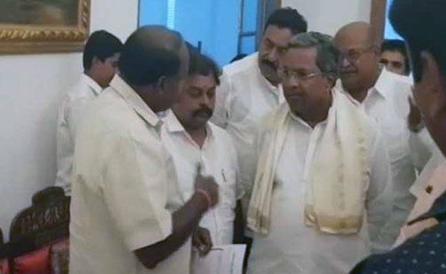 Uneasy Allies? Siddaramaiah, Kumaraswamy Meet Under Governor's Roof