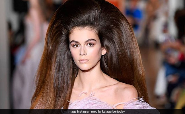 Kaia Gerber's Feathered Gown And Voluminous Hair At Paris Fashion Week Has Left Us Speechless
