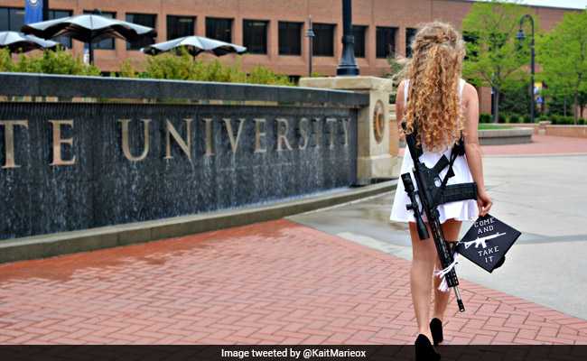Story Behind The Viral Photo Of Girl Posing With Rifle At Her Graduation
