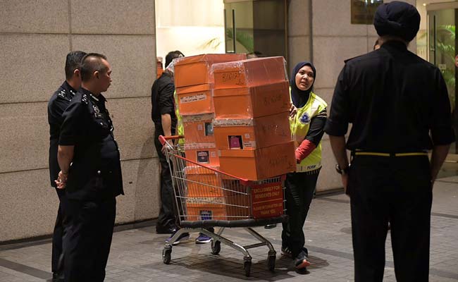 Hundreds Of Handbags, 72 Suitcases Full Of Jewels Seized From Ousted Malaysian Leader's Home
