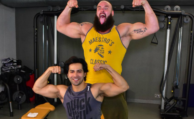 Brave Varun Dhawan Flexed Muscle With WWE Superstar Braun Strowman And Survived