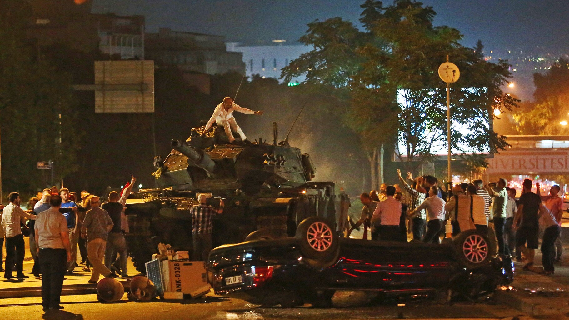 Tanks move into position as Turkish people attempt to stop them, in Ankara, Turkey. (Photo: AP)