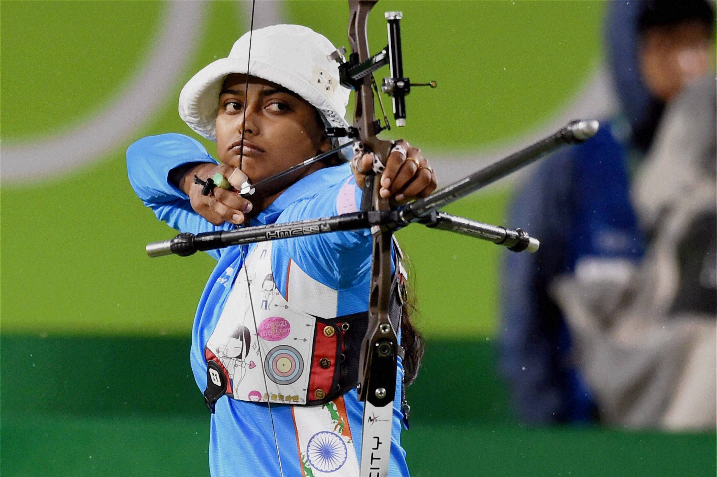 Deepika Kumari prepares to release her arrow during the women's archery event (Photographer: Atul Yadav/ PTI)