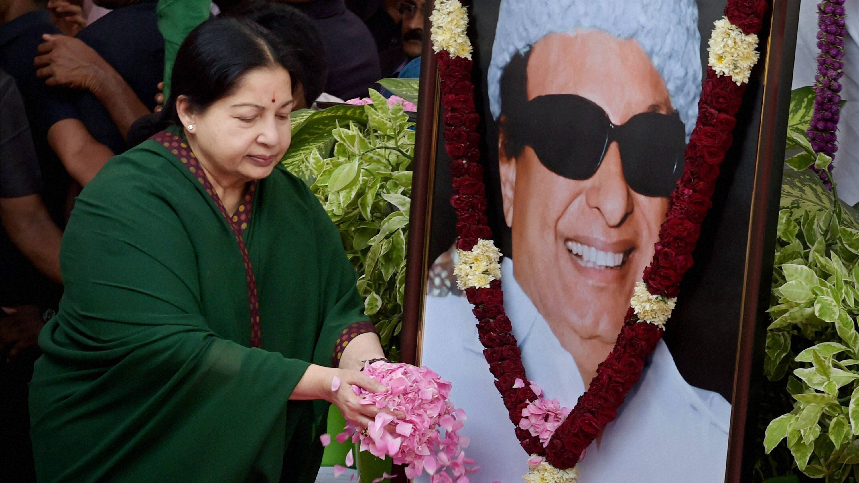 Tamil Nadu CM J Jayalalithaa paying floral tribute to her mentor MGR in a file photo. (Photo: PTI)