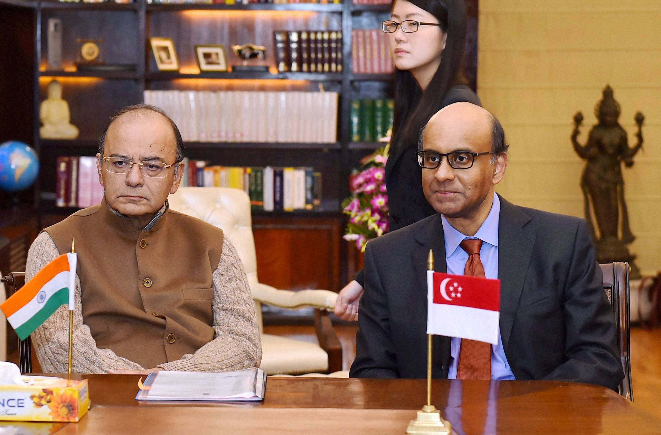 Finance Minister, Arun Jaitley and Deputy Prime Minister of Singapore, Tharman Shanmugaratnam during signing of an agreement on Third Protocol to amend the tax treaty. (Photographer: Kamal Singh/PTI)