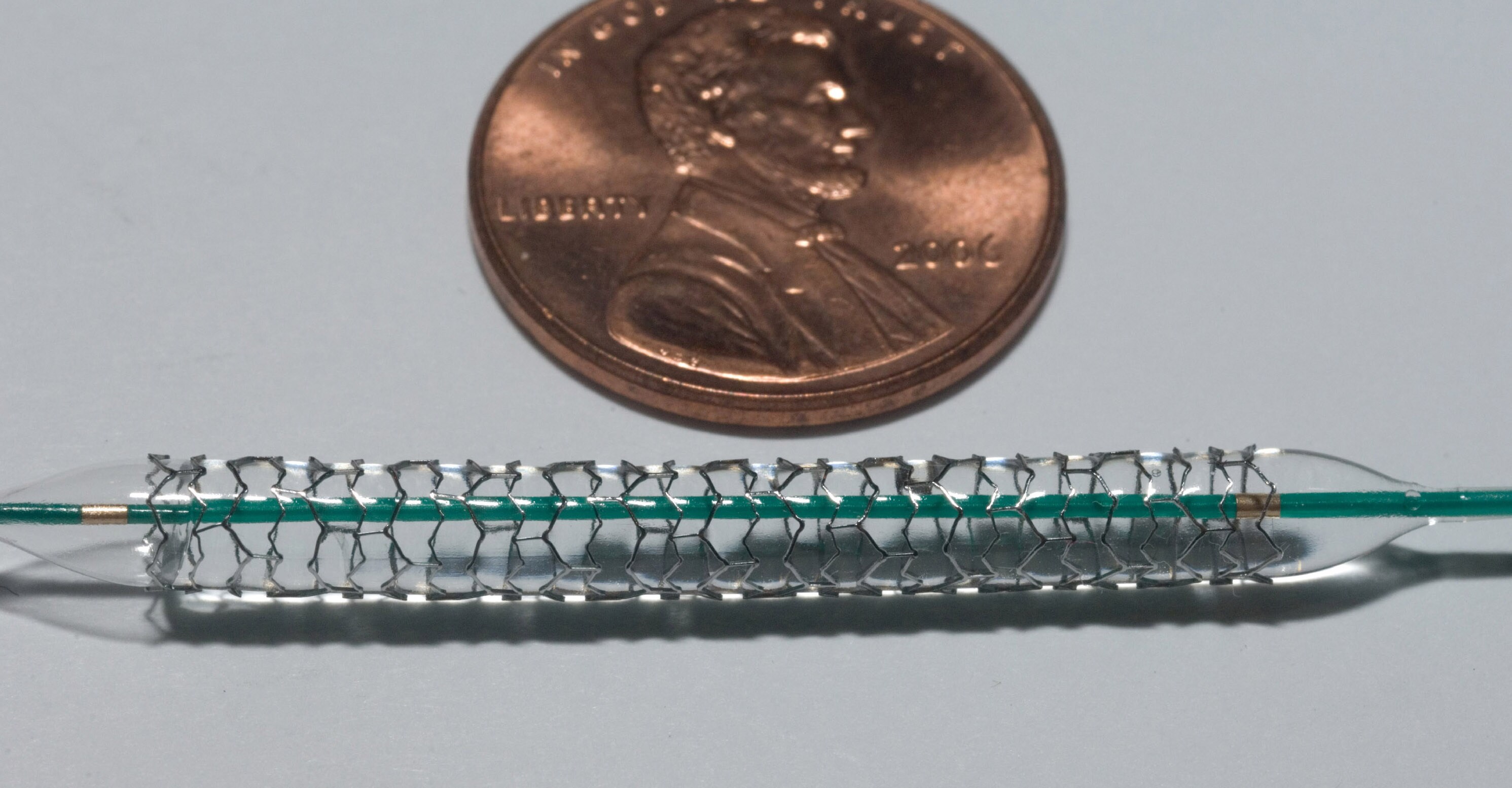 Boston Scientific's Taxus Express II stent. The U.S. penny shows relative size of this sample stent. (Photographer: Scott Saltzman/Bloomberg News)
