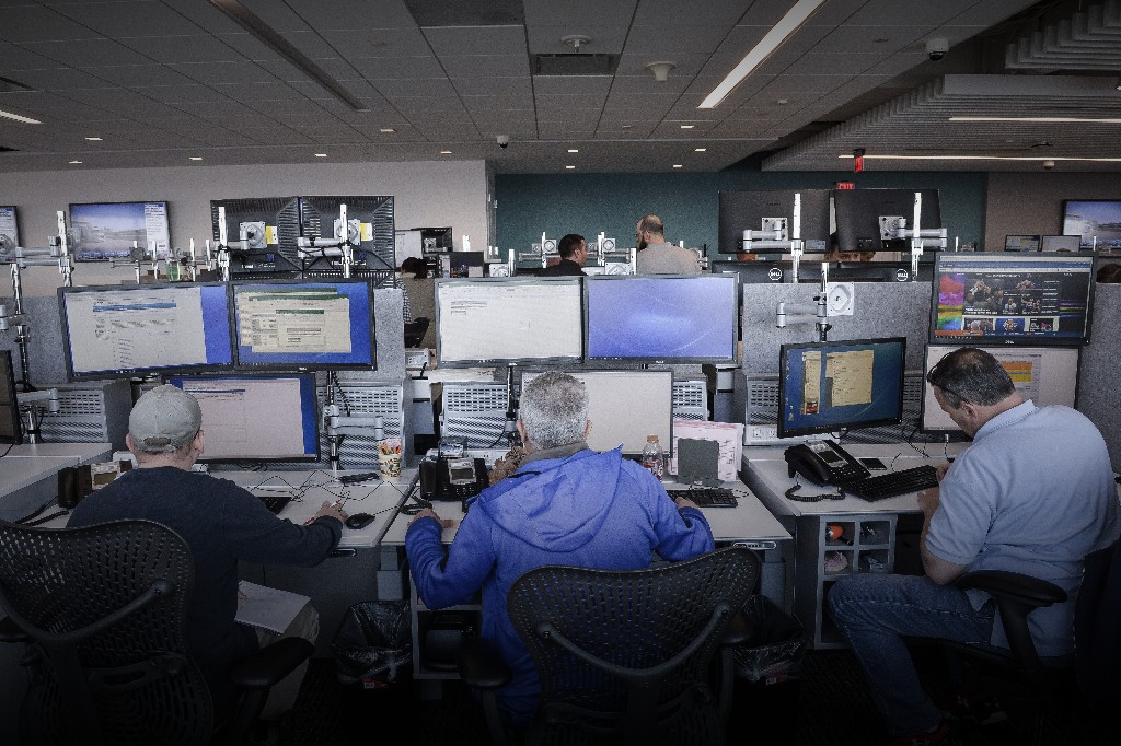 Traders work at the new Nasdaq Inc. trading floor of the Philadelphia Stock Exchange (PHLX) inside FMC Tower in Philadelphia, Pennsylvania, U.S. (Photographer: Charles Mostoller/Bloomberg)