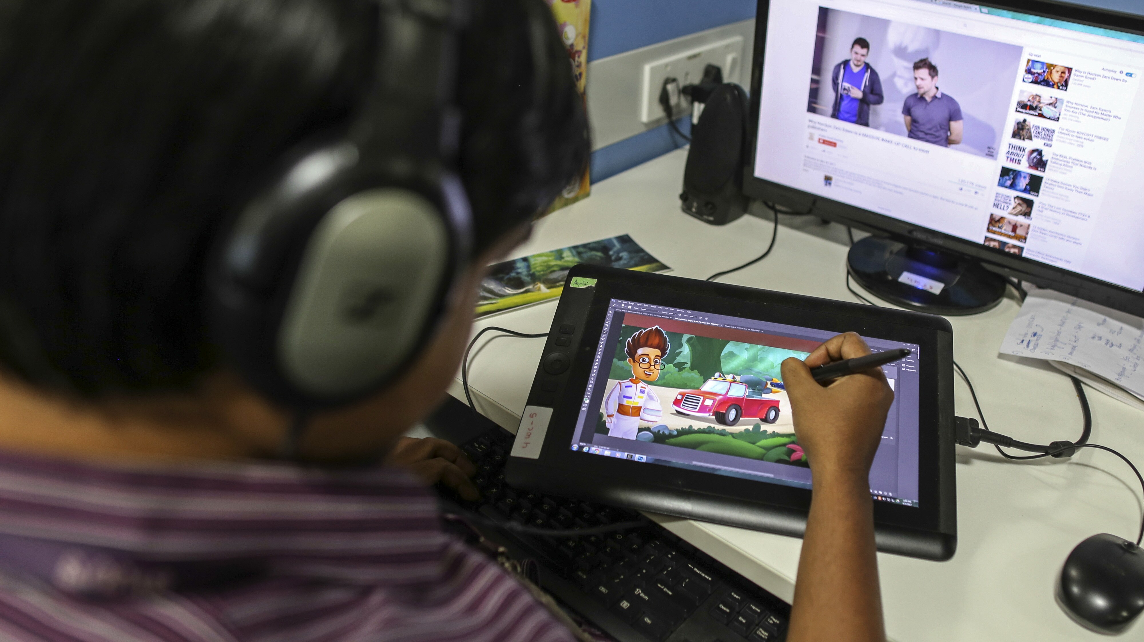 An employee draws a cartoon for the BYJU'S learning app in the media department of the Think and Learn Pvt. office in Bengaluru. (Photographer: Dhiraj Singh/Bloomberg)