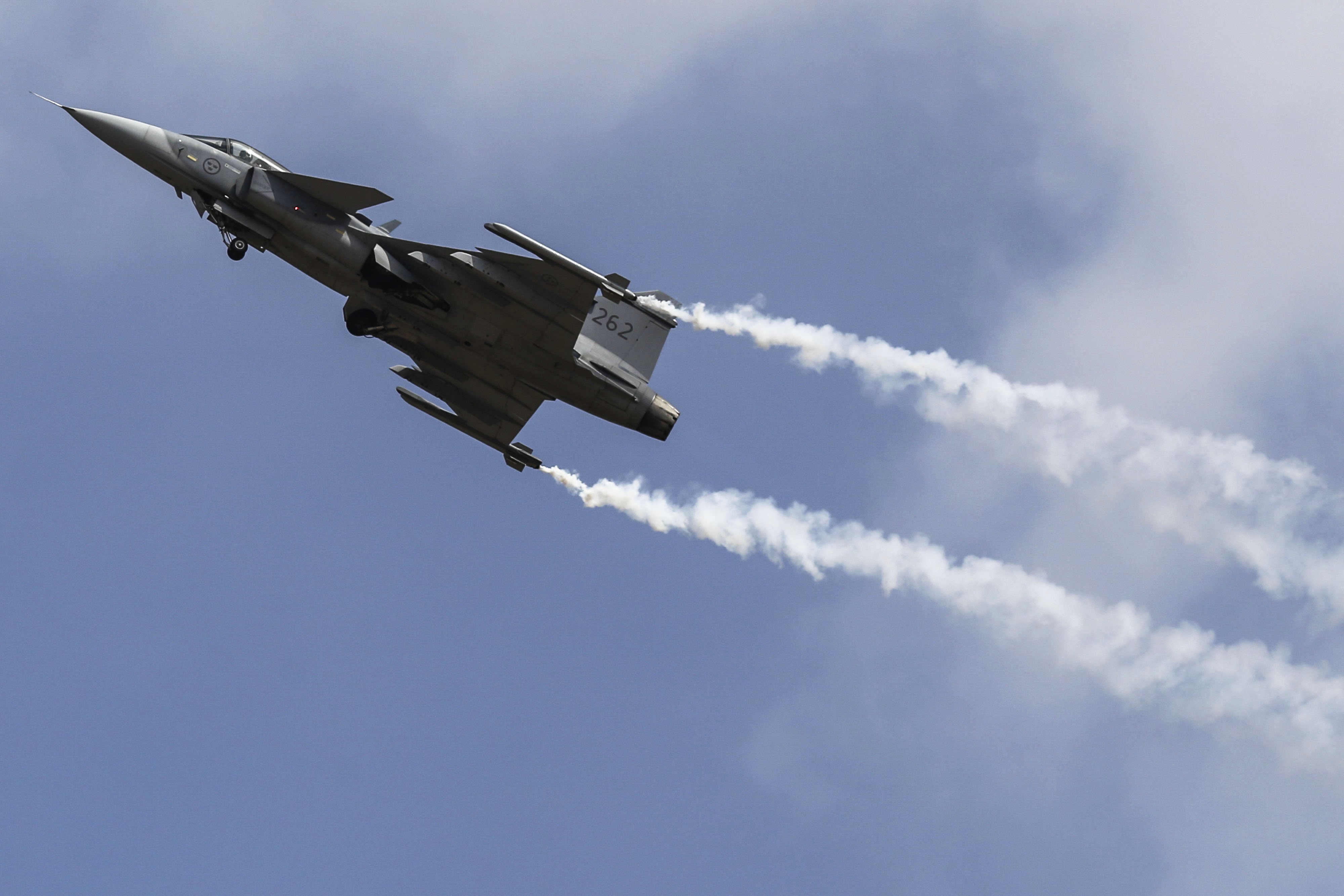 A Saab Gripen ighter jet performs an aerial display at the Aero India air show at Air Force Station Yelahanka in Bengaluru, India. (Photographer: Dhiraj Singh/Bloomberg)