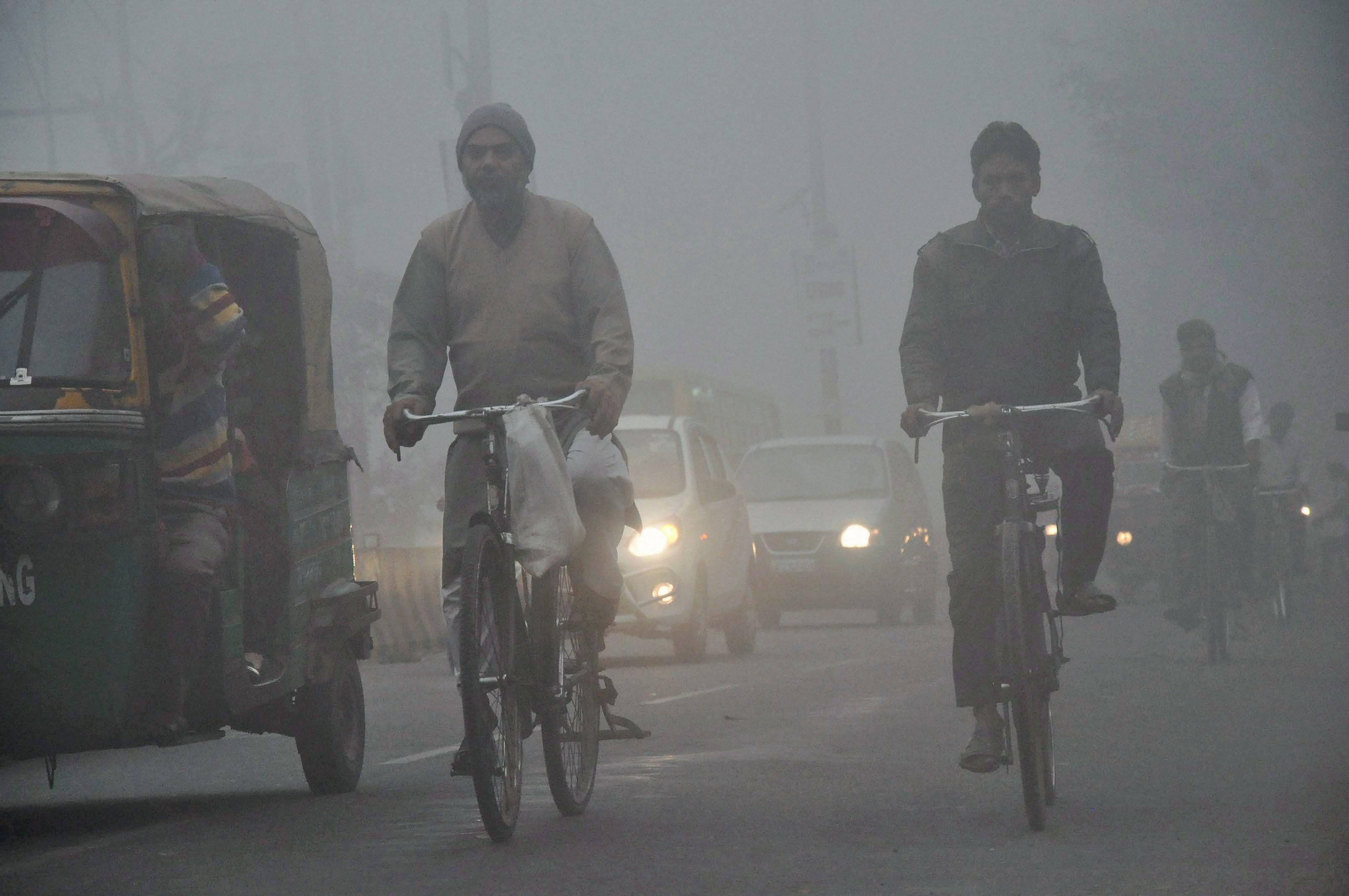 People commute during the foggy in Moradabad district on Tuesday. (Source: PTI)