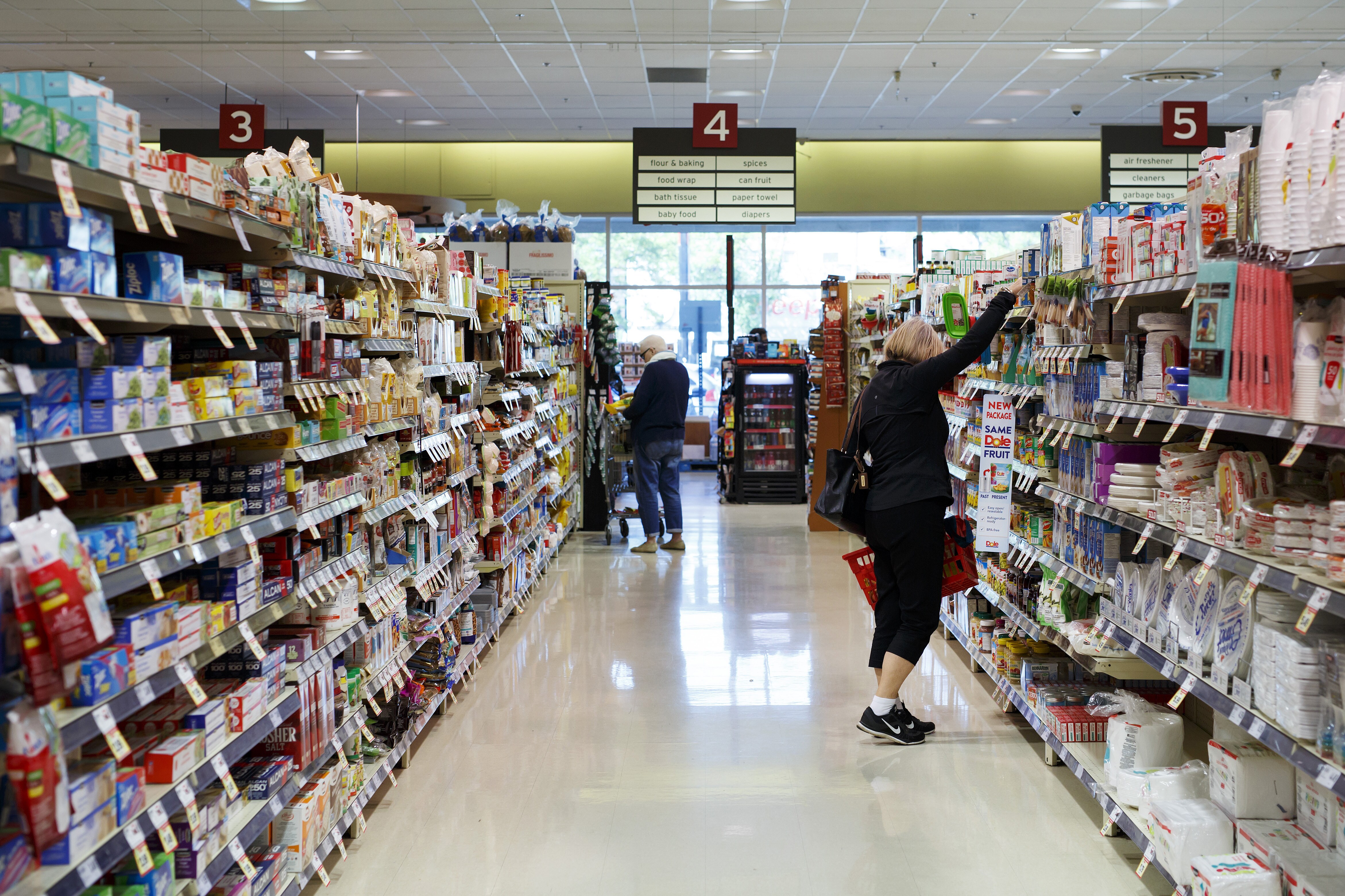 Customers shop inside a Metro Inc. grocery store in Toronto, Ontario, Canada. (Photographer: Cole Burston/Bloomberg)