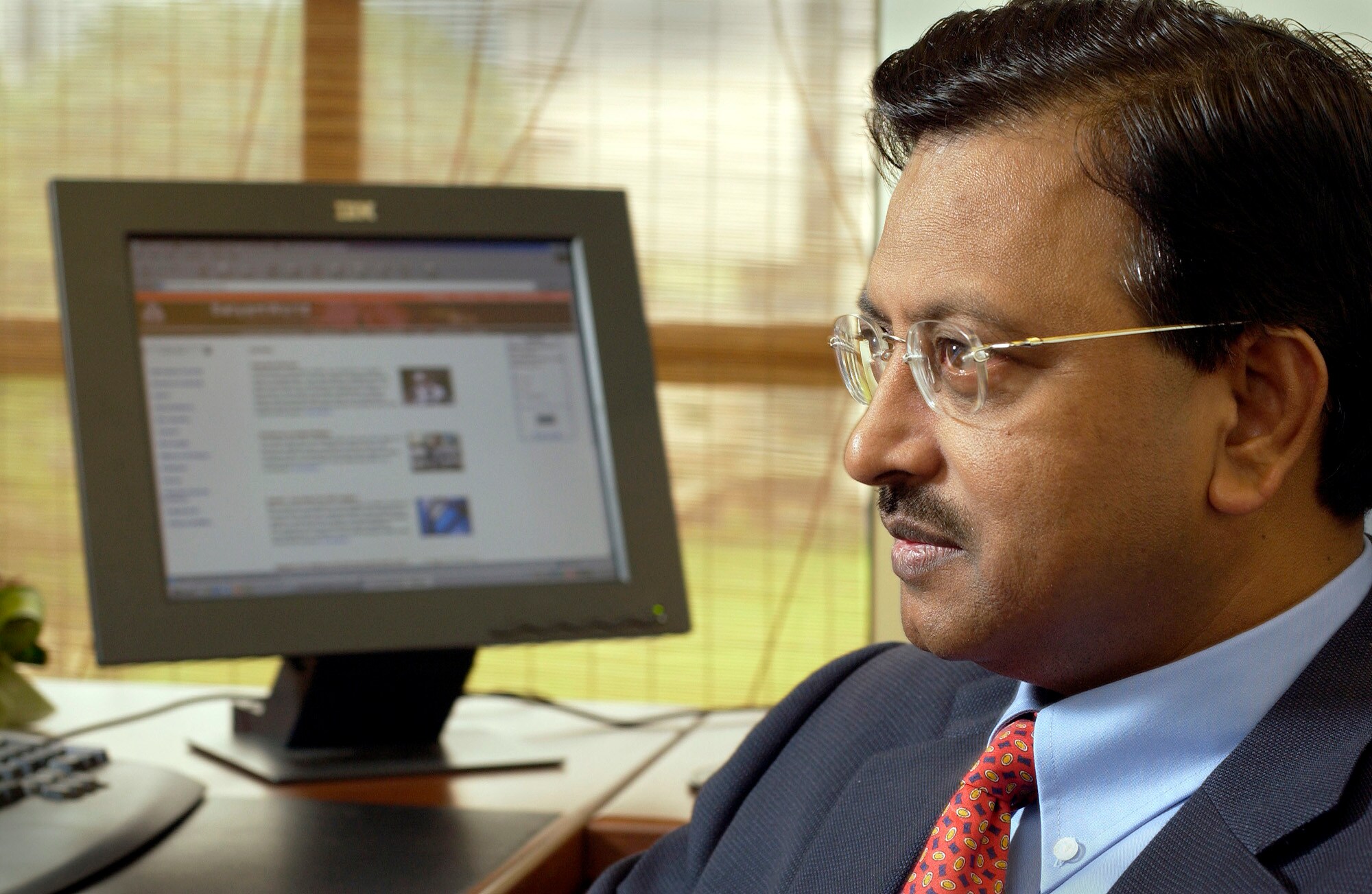 Satyam Computers Chairman, Ramalinga Raju, speaks to Bloomberg in his Singapore office Thursday, February 27, 2003. (Photographer: Munshi Ahmed/Bloomberg News)