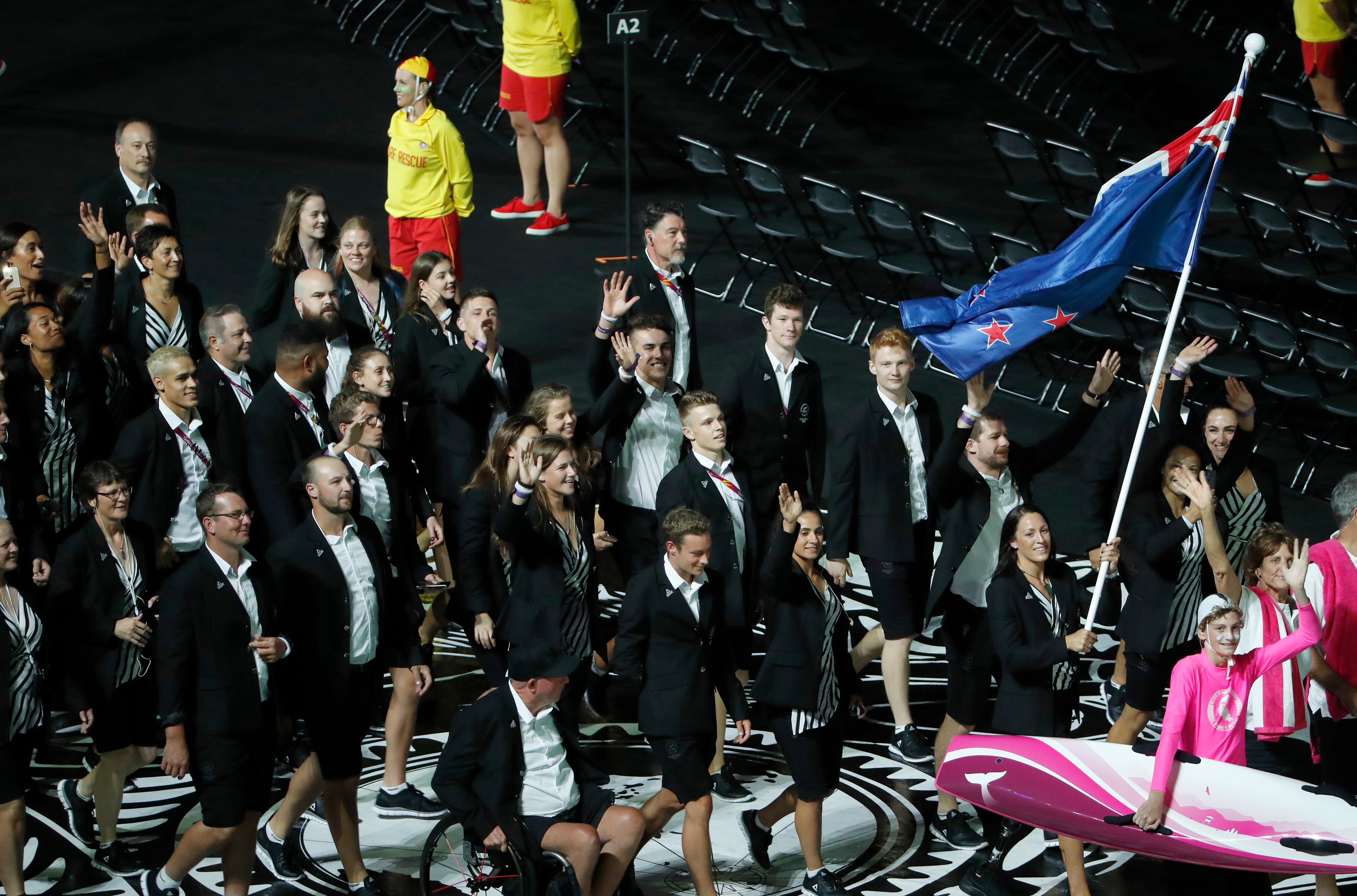New Zealand flag-bearer Sophie Pascoe leads her team into Carrara Stadium for the opening ceremony of the 2018 Commonwealth Games.