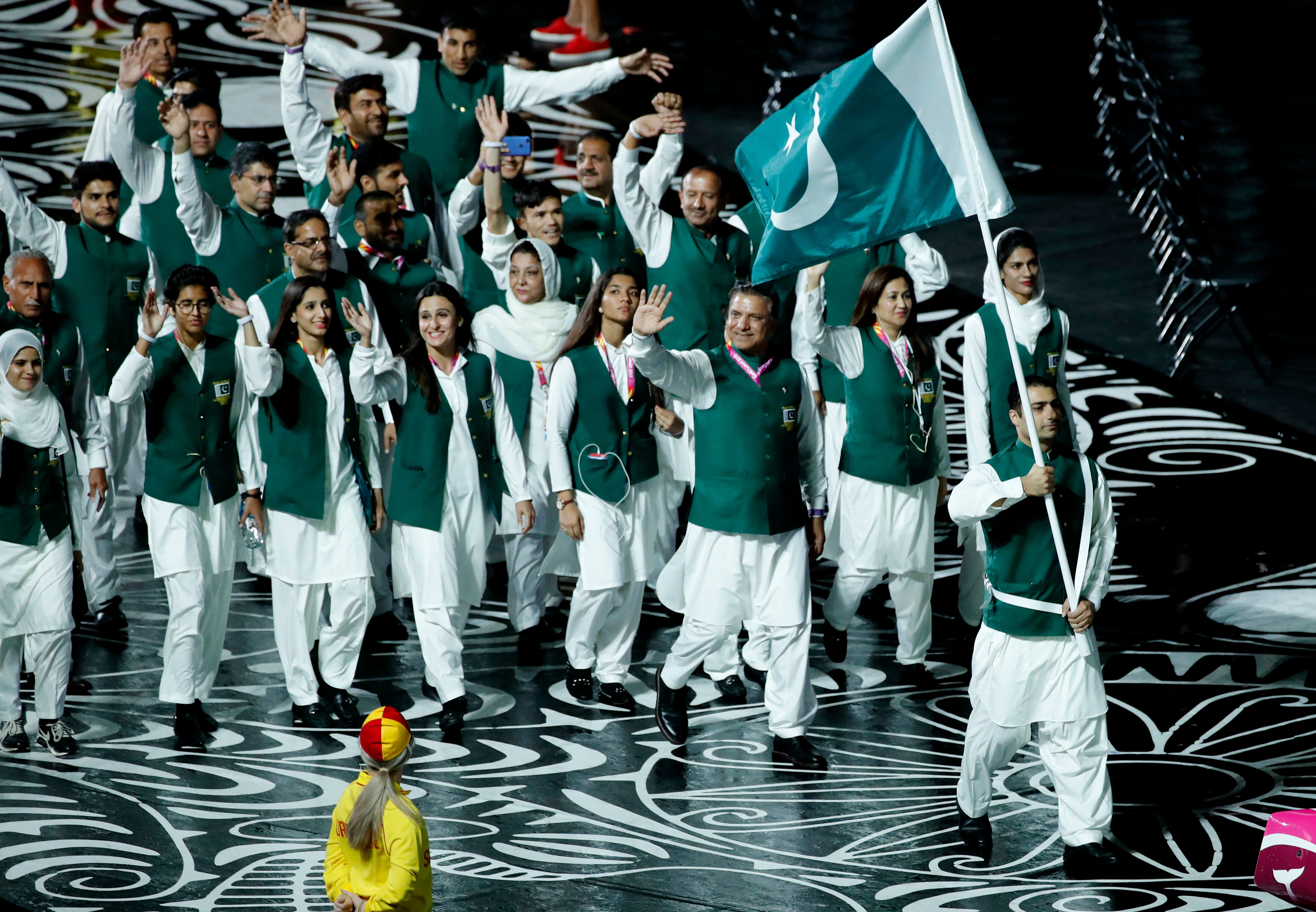 Team Pakistan is led by flag-bearer Usman at Carrara Stadium at the opening ceremony for the 2018 Commonwealth Games.