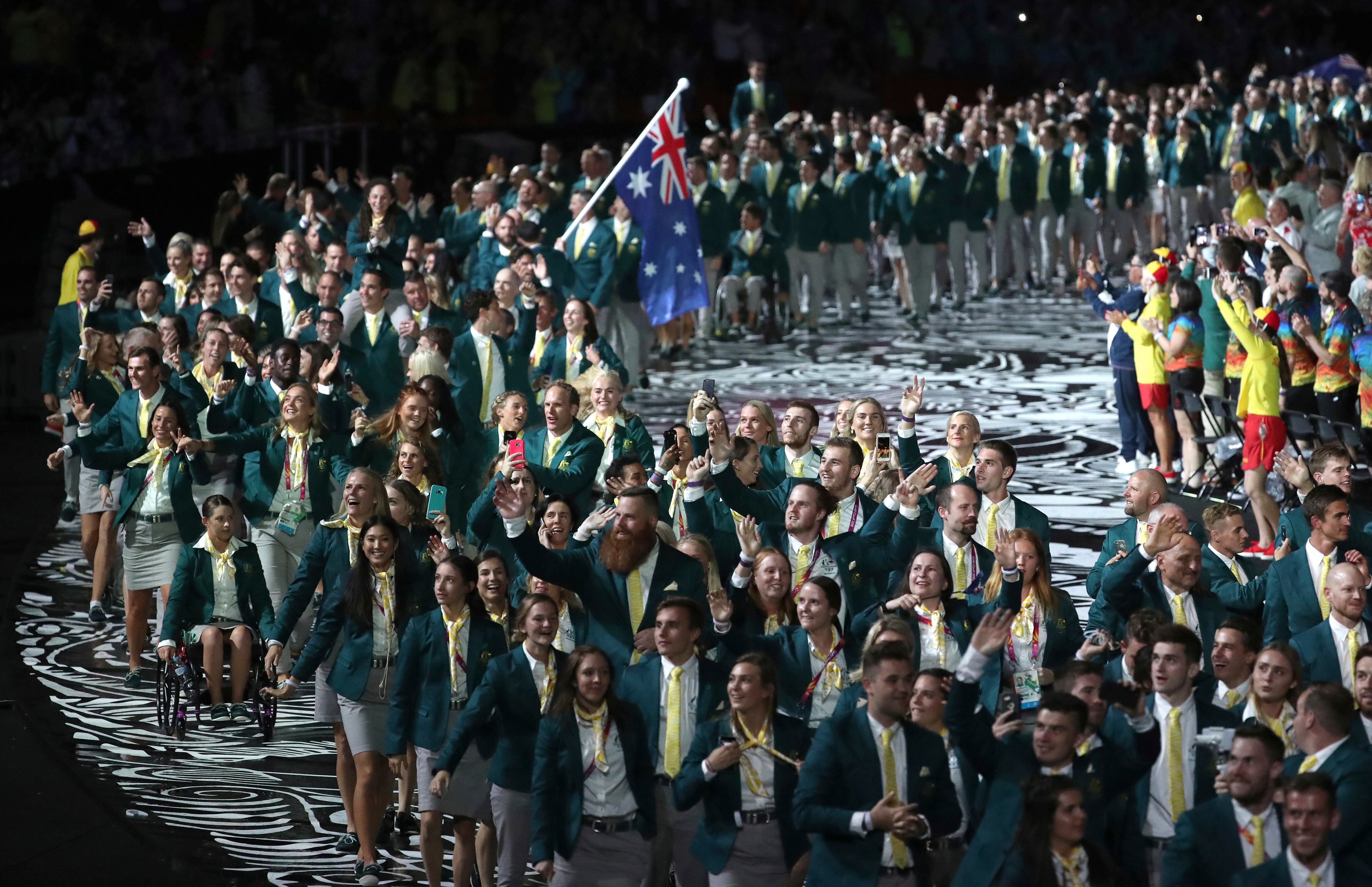 Team Australia is lead by flag-bearer Mark Knowles at Carrara Stadium for the opening ceremony for the 2018 Commonwealth Games.