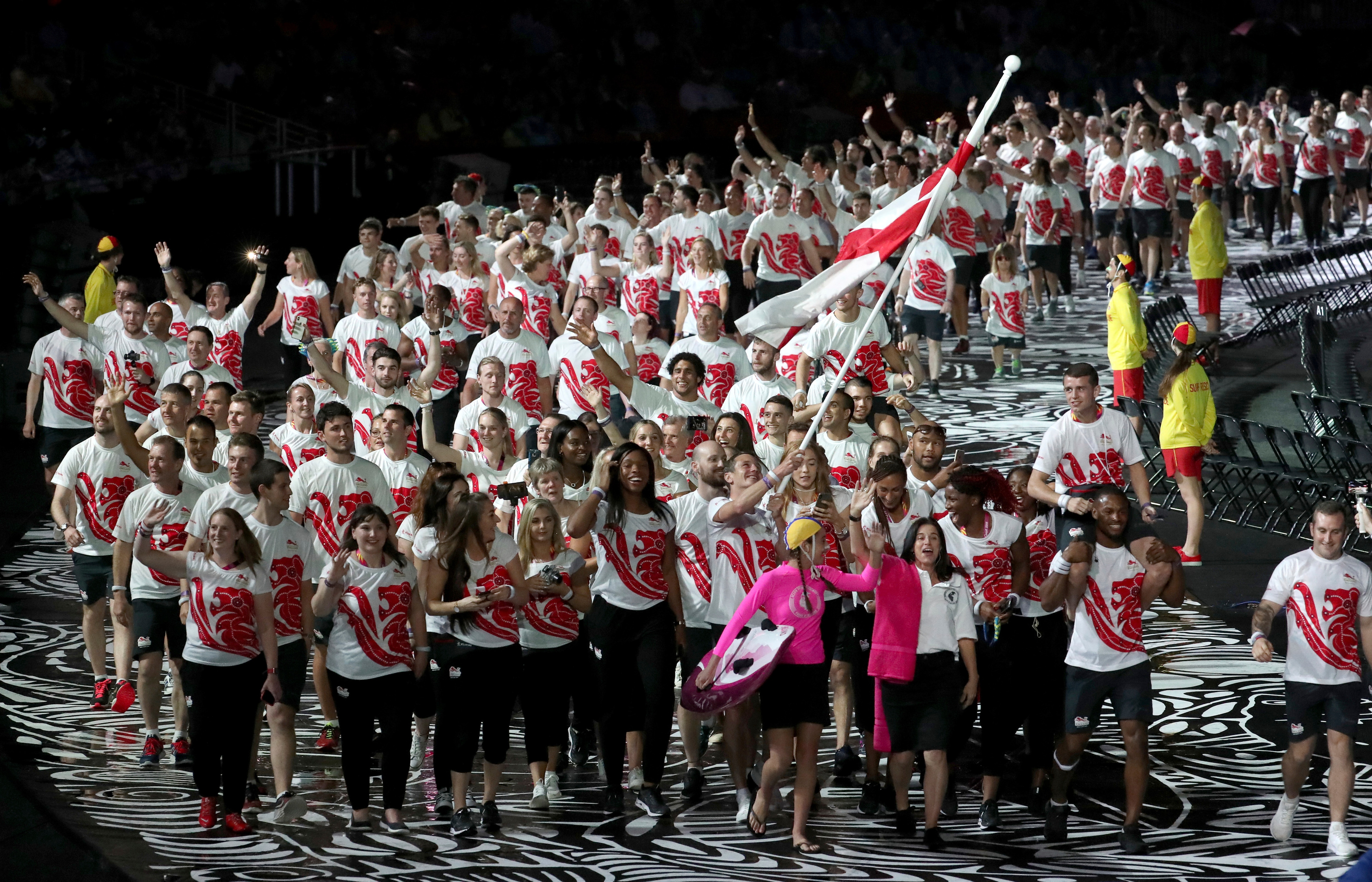 England's flag-bearer Alistair Brownlee walks with his teammates into Carrara Stadium for the opening ceremony of the 2018 Commonwealth Games.