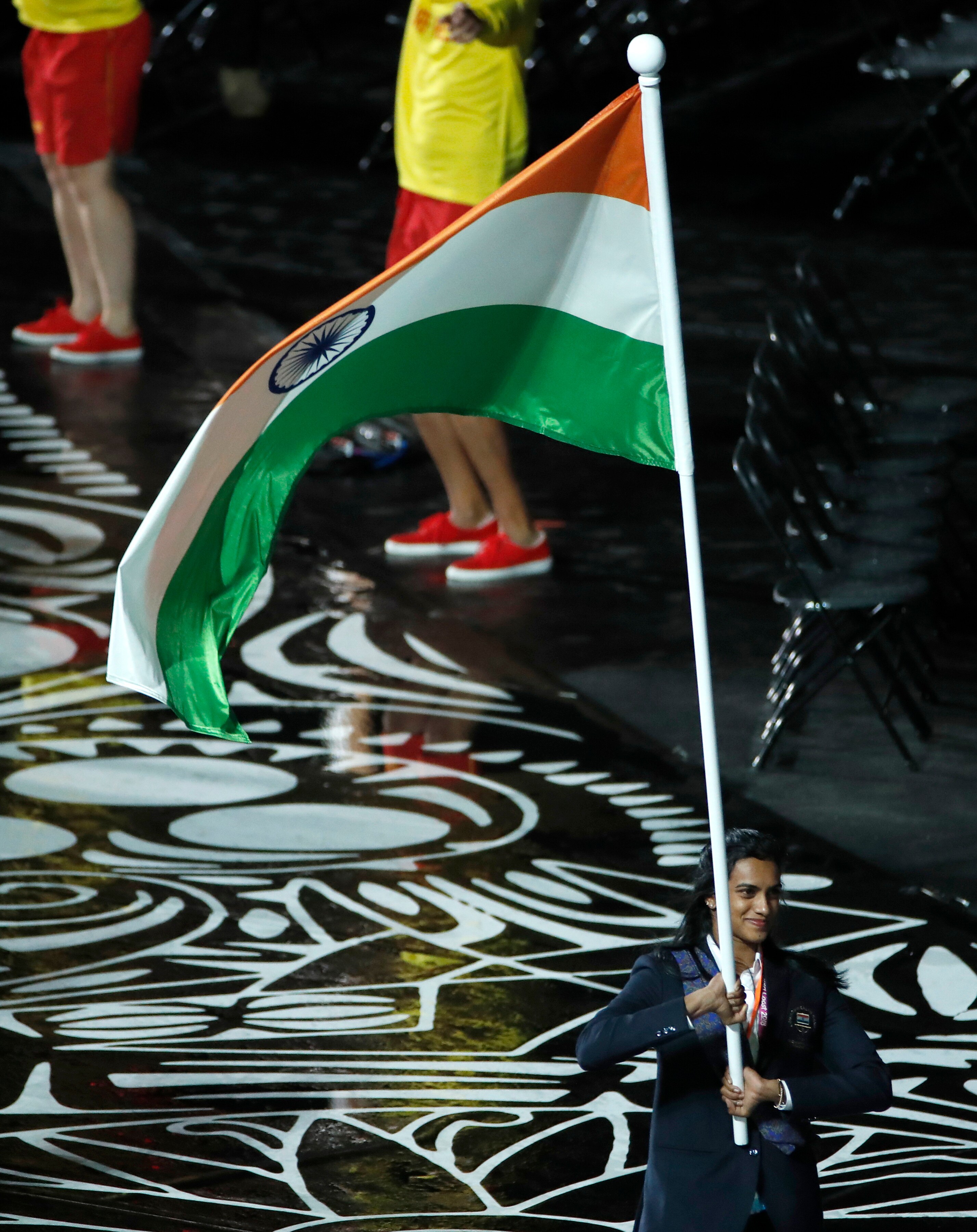 India's flag-bearer PV Sindhu leads her team into Carrara Stadium for the CWG opening ceremony.