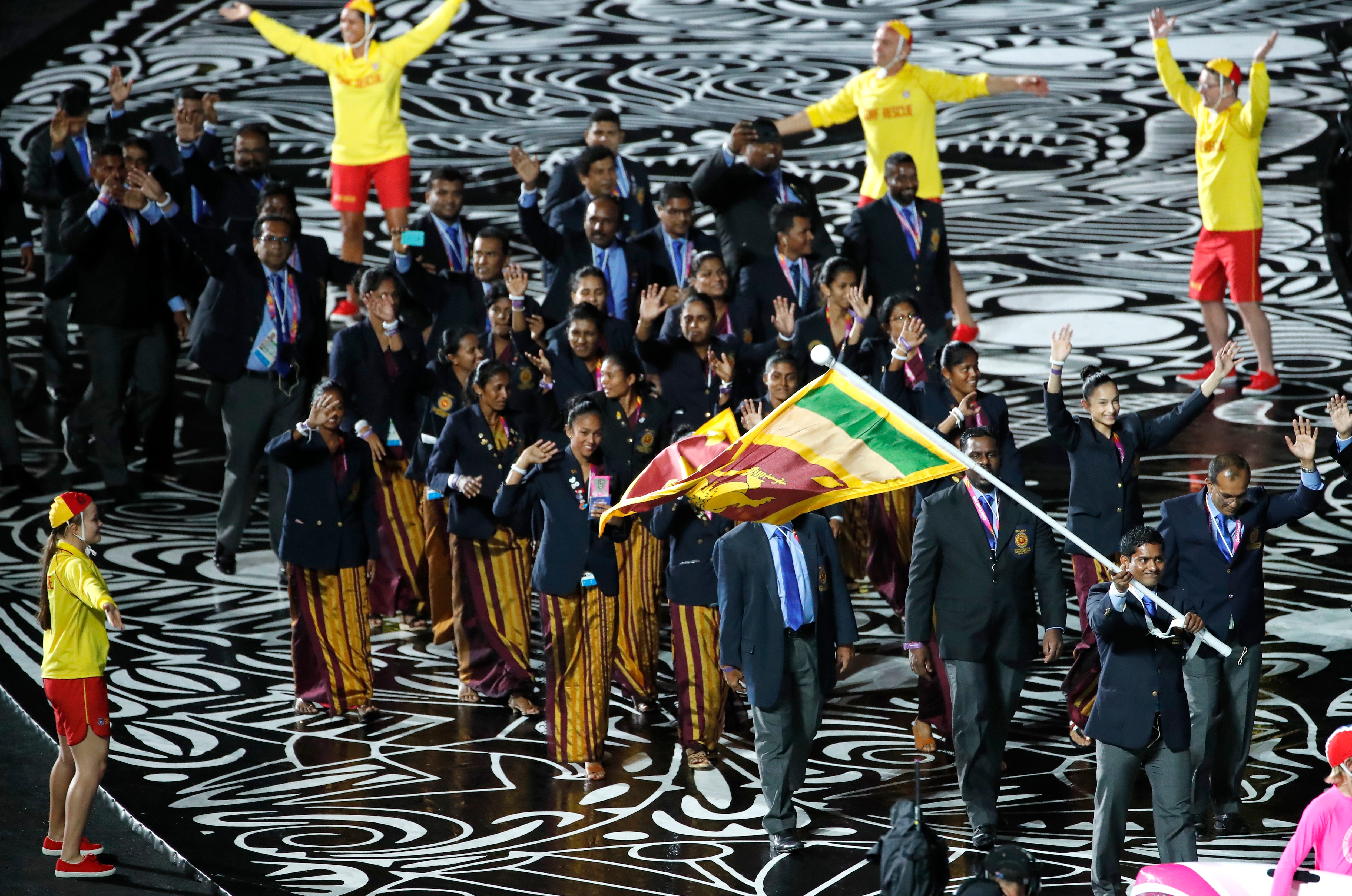 Team Sri Lanka is lead by flag-bearer Chinthana Vidanage at Carrara Stadium at the opening ceremony of the 2018 Commonwealth Games.