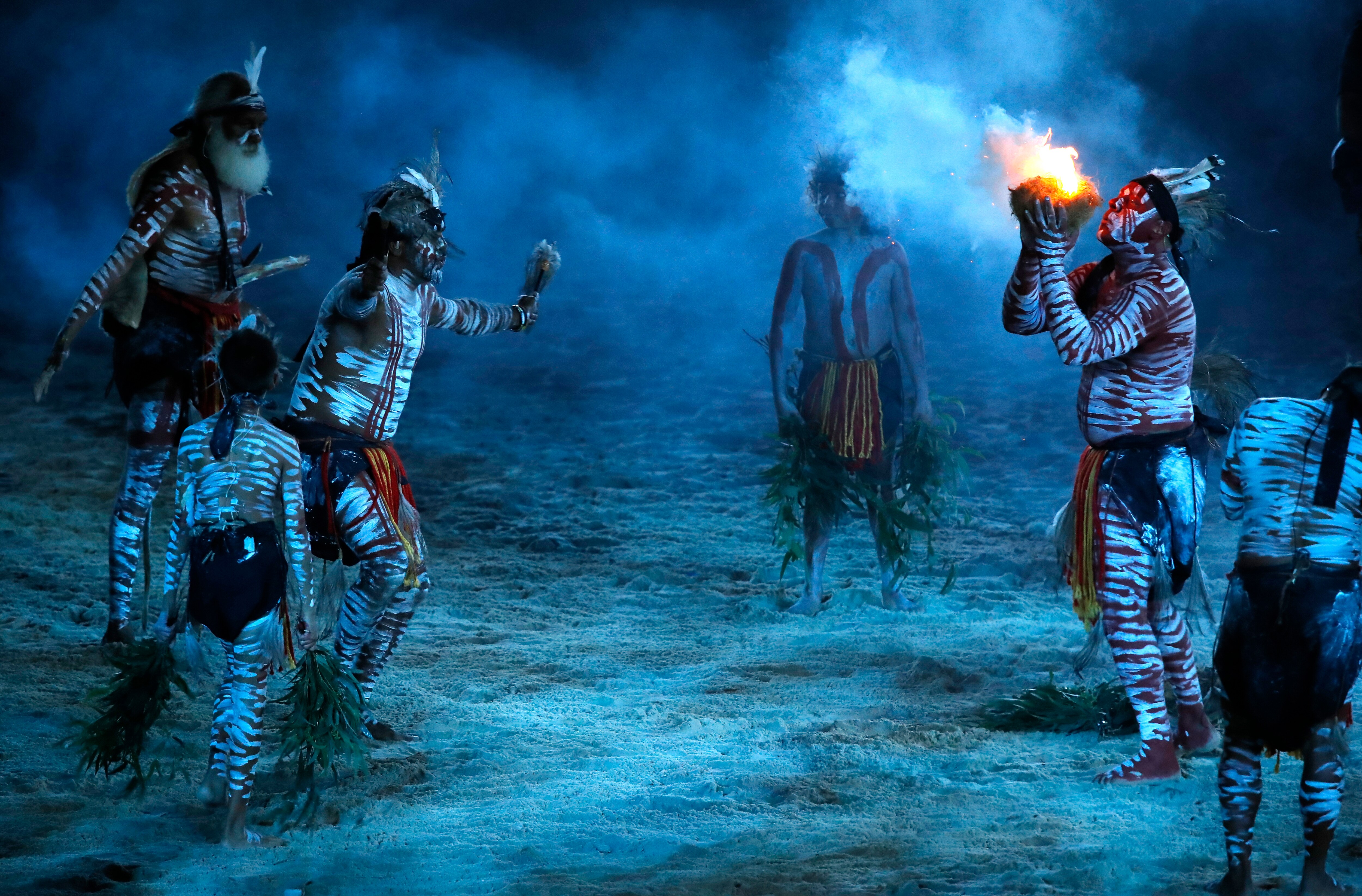 Aborigines perform a smoking ceremony at Carrara Stadium during the opening ceremony for the 2018 Commonwealth Games.