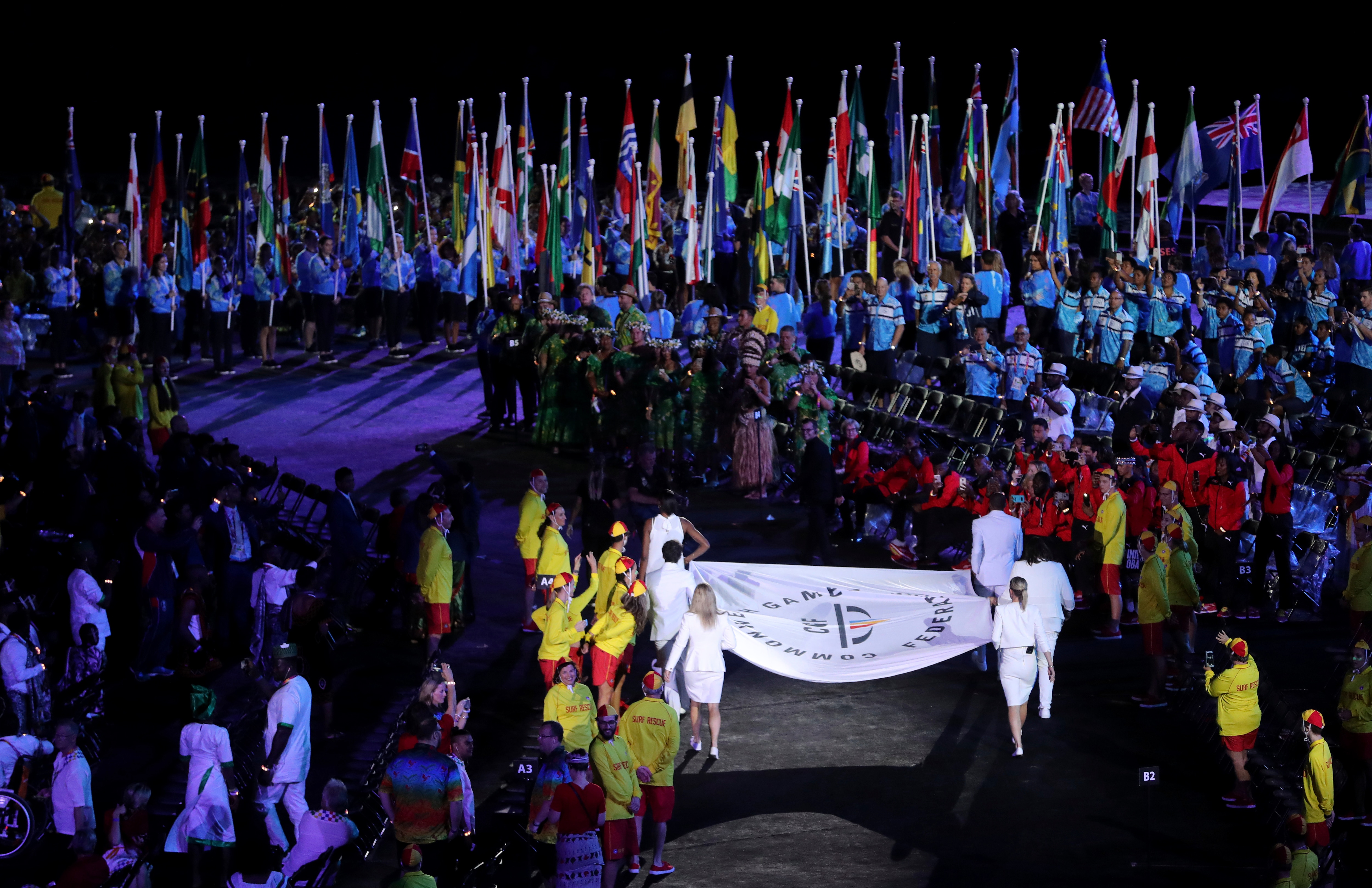The Commonwealth Games flag is carried into Carrara Stadium for the opening ceremony for the 2018 Commonwealth Games.