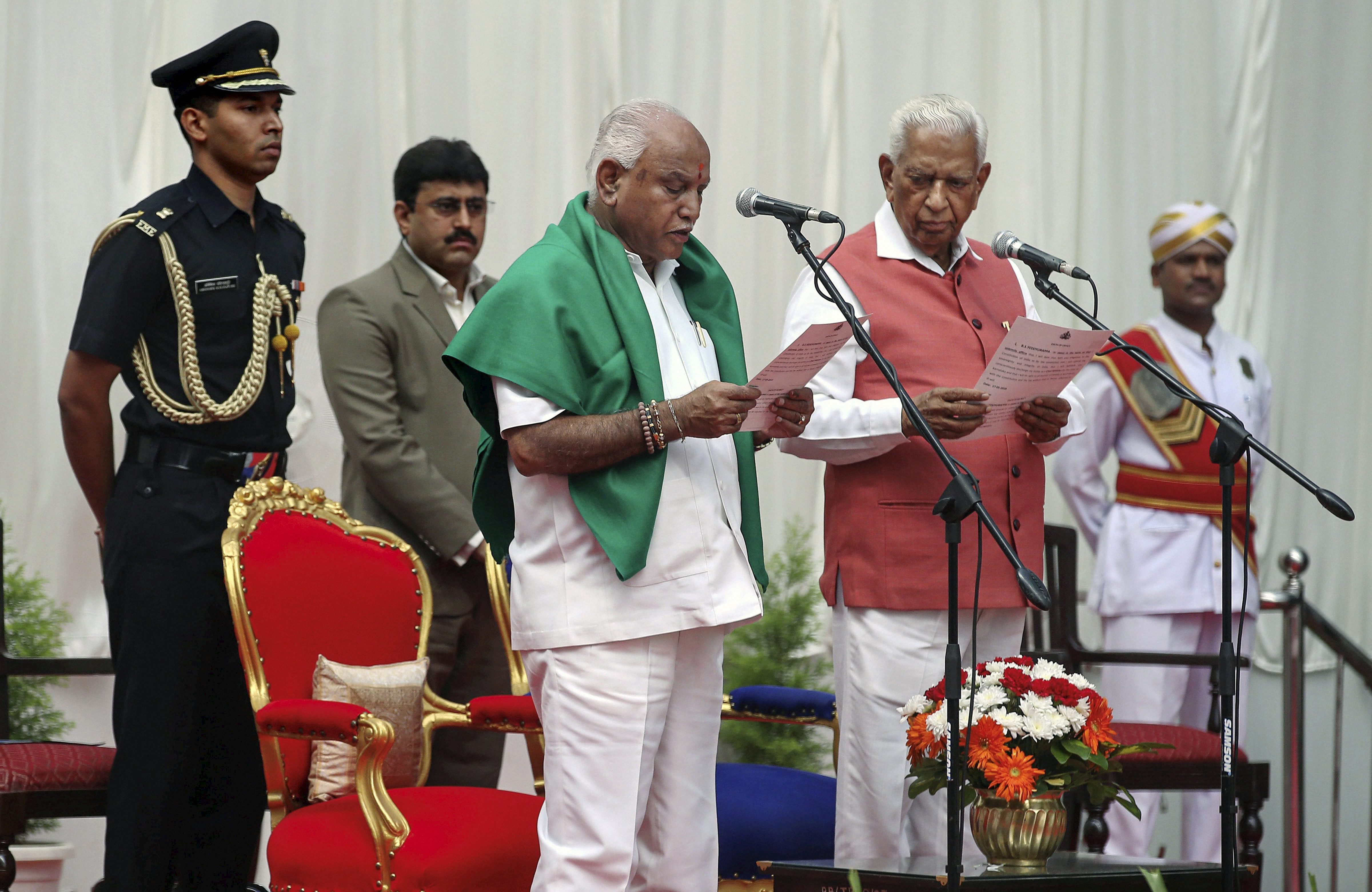 Karnataka Governor Vajubhai Vala administers oath to Bharatiya Janata Party (BJP) leader B S Yeddyurappa as Chief Minister of the state at a ceremony in Bengaluru. (Source: PTI)