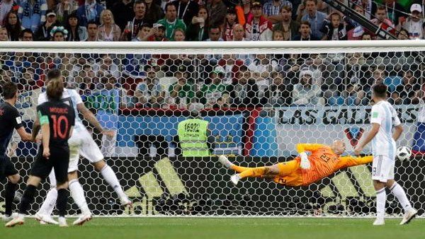 Luka Modric watches his shot go past an outstretched Willy Caballero, the Argentine goalkeeper