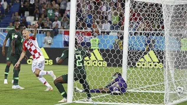 Croatian defender Demagoj Vida celebrates after Nigeria's Etebo scores an own goal
