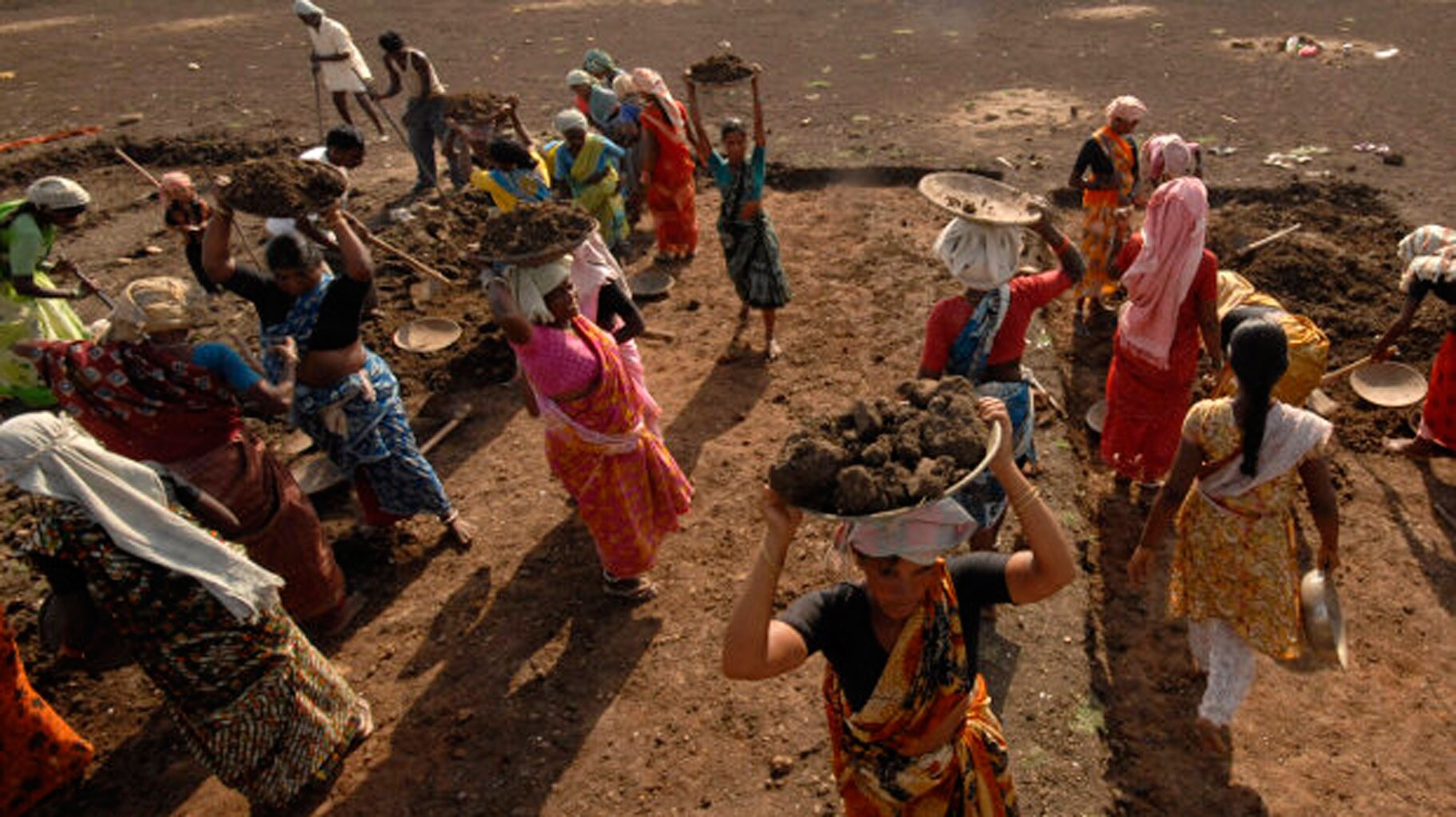 Labourers work on a dried lake to try and revive it under the Mahatma Gandhi National Rural Employment Guarantee Act (MGNREGA) on the outskirts of Hyderabad. Representational image.