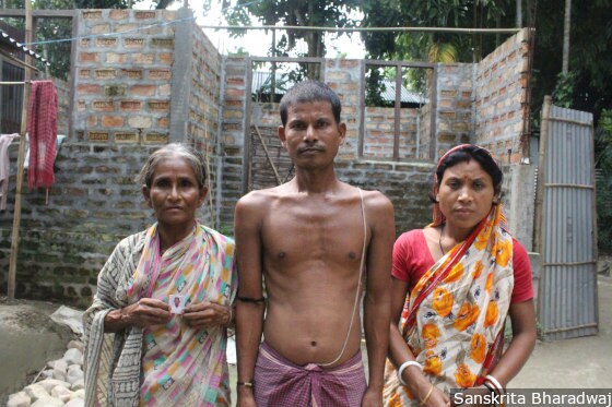 Mahendra Barman, 30, (centre) with his mother and wife. Mahendra's father, Deben Barman, 70, hung himself from a tree on Aug. 7, 2018.
