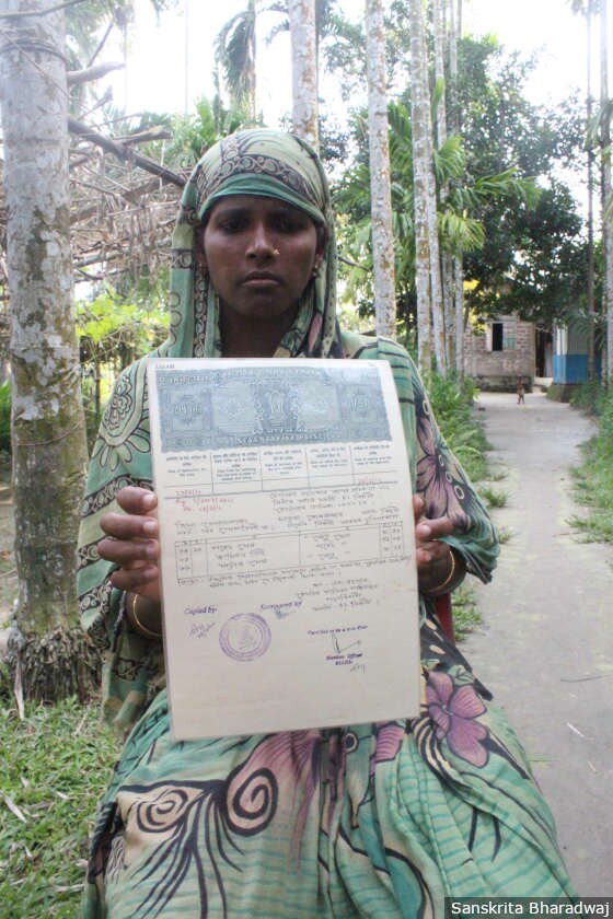 Moriam Begum, 33, with a certificate copy of the 1966 electoral rolls with her grandfather's name. She received a notice in 2015 from the Assam Border Police Organisation, asking her to prove her citizenship at the foreigner's tribunal in Bongaigaon. Aklima Bewa, 62, Moriam's mother, killed herself in 2016 fearing for her daughter's citizenship, said the family.