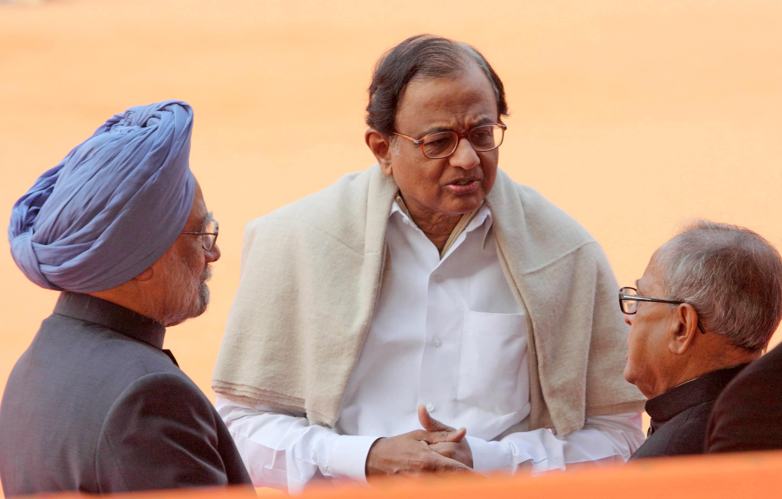 Then-Prime Minister Manmohan Singh, with P Chidambaram and Pranab Mukherjee, in New Delhi. (Photographer: Pankaj Nangia/Bloomberg)