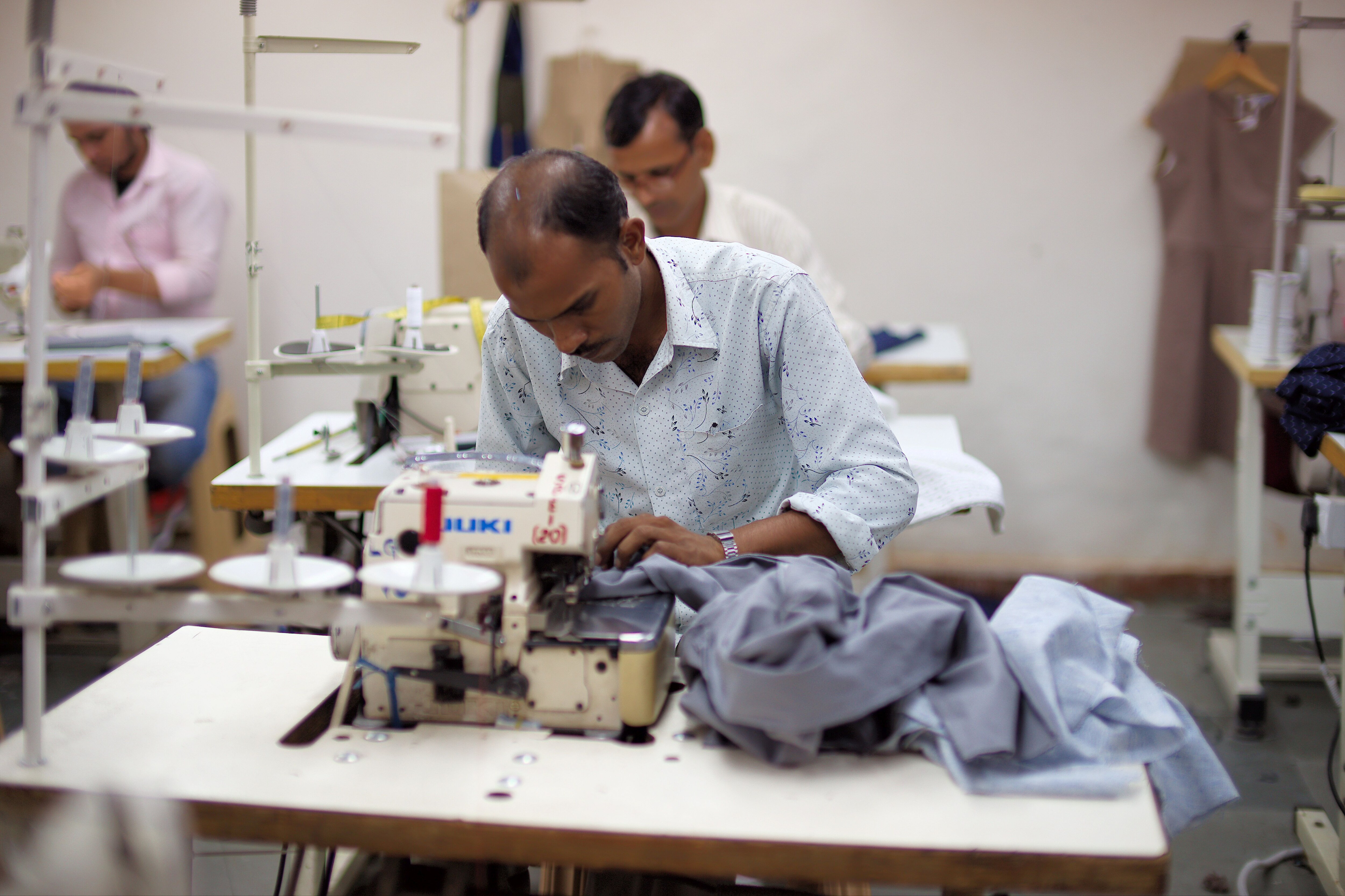 Tailors stitching at one of Salt Attire's unit. (Source: Salt Attire)