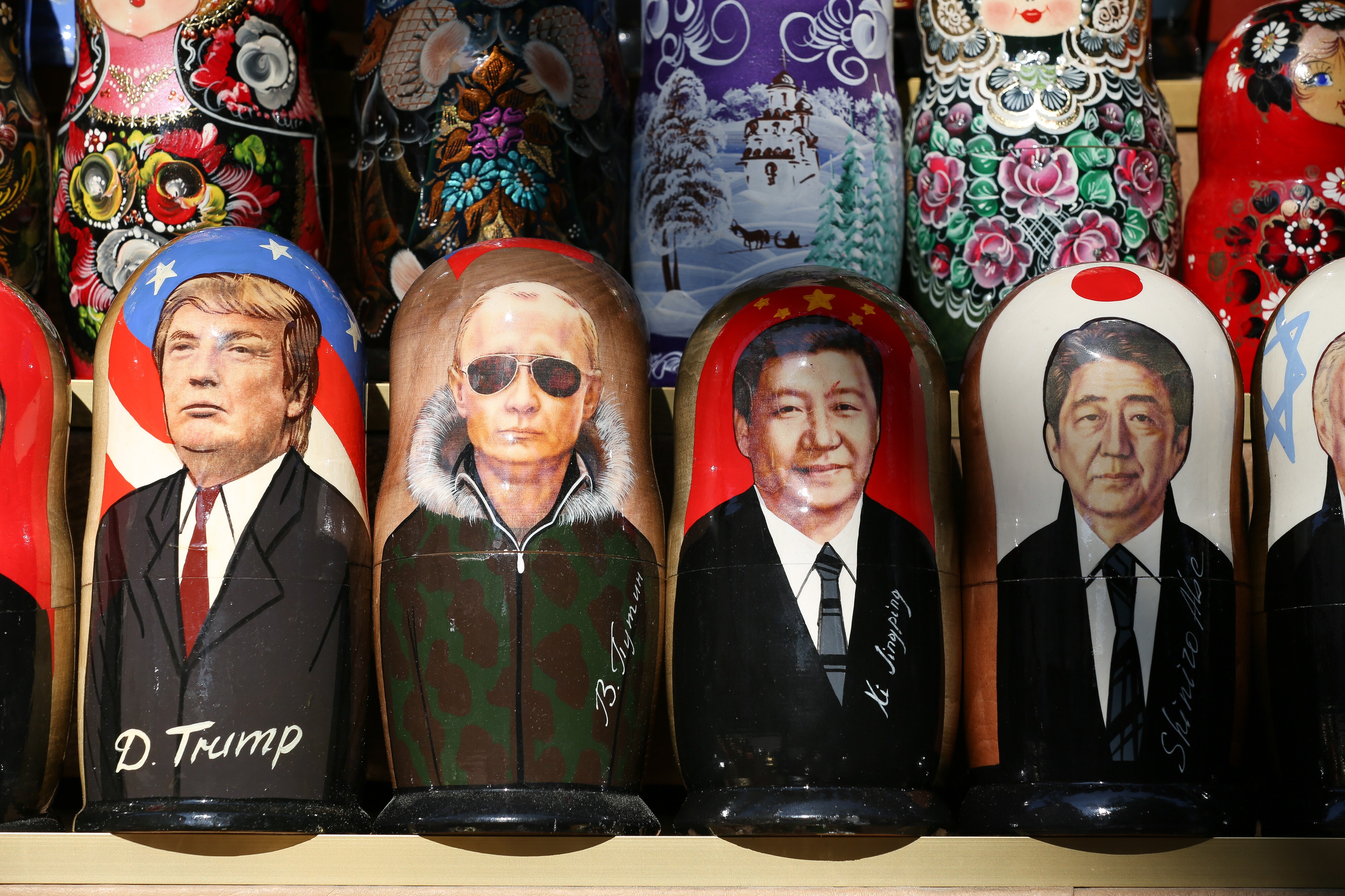 Matryoshka dolls depicting, Donald Trump, Vladimir Putin, Xi Jinping, and Shinzo Abe, at a stall in St. Petersburg, Russia. (Photographer: Andrey Rudakov/Bloomberg)