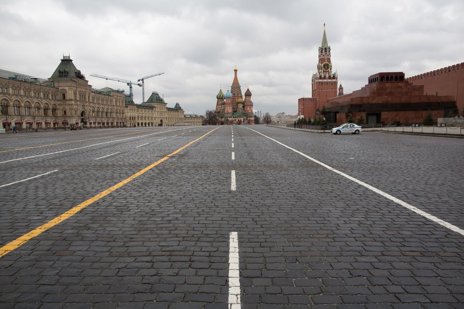 Police patrol a deserted Red Square on April 2. (Photographer: Andrey Rudakov/Bloomberg)