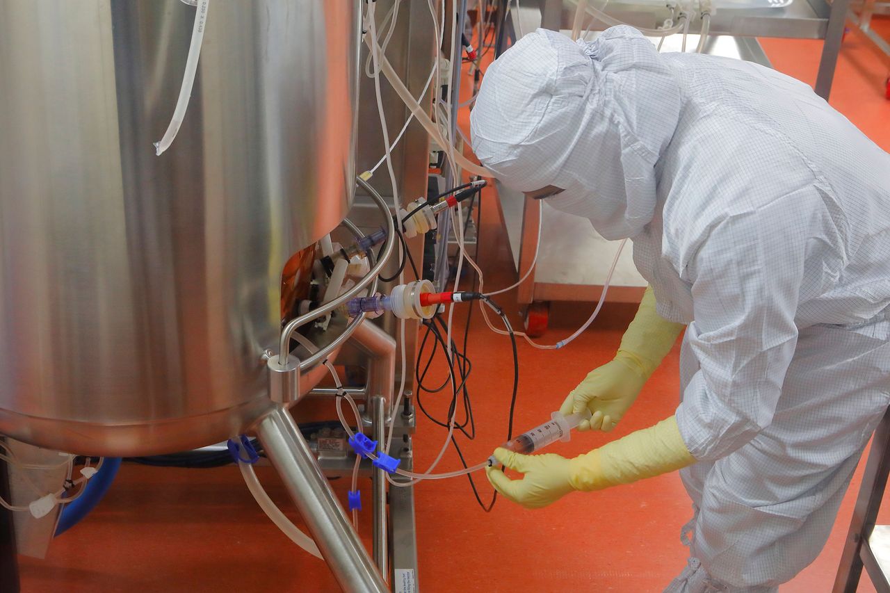A Serum technician checks on coronavirus vaccine production. (Photographer: Subhash Sharma For Bloomberg Businessweek)