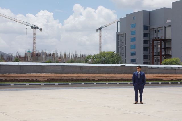 Poonawalla in front of the construction of a vaccine factory. (Photographer: Subhash Sharma For Bloomberg Businessweek)