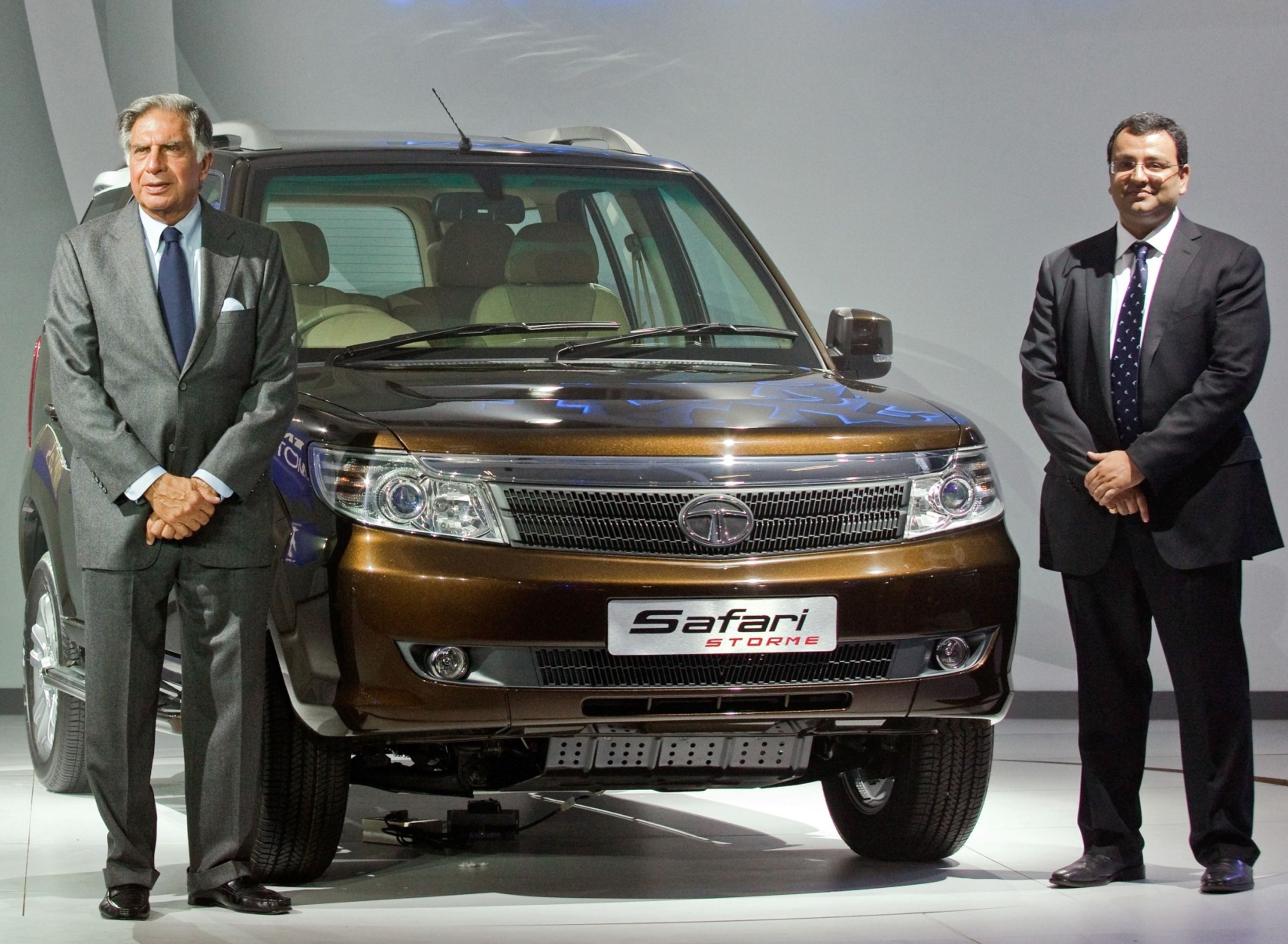 Ratan Tata, then chairman of Tata Motors Ltd., left, and Cyrus Mistry, then deputy chairman of Tata Sons Ltd. at the launch of the Tata Safari Storm SUV at the Auto Expo 2012 in January. (Photographer: Graham Crouch/Bloomberg)