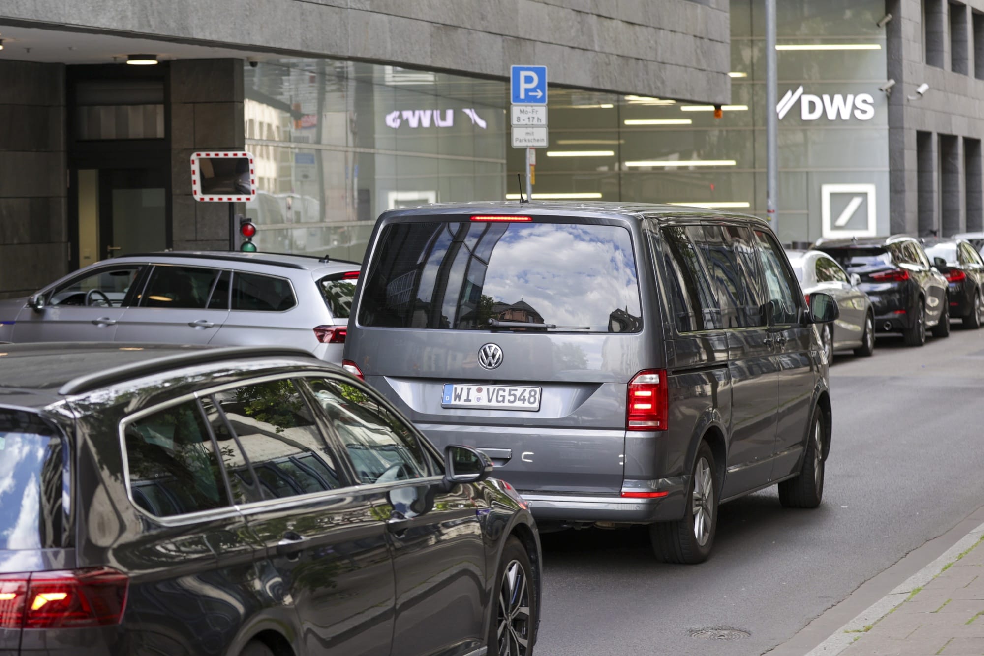Police vehicles arrive at the DWS offices in Frankfurt on May 31.Photographer: Alex Kraus/Bloomberg